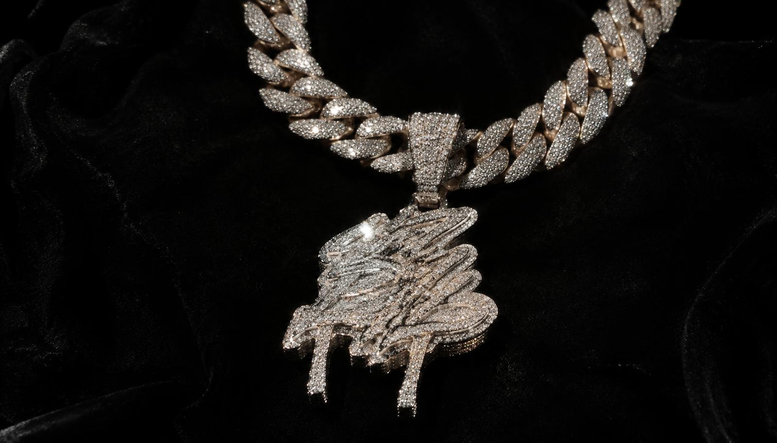 Iced out cuban link chain with pendant